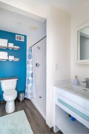A bathroom with a toilet, shower, and sink. - Haven in the trees, minutes from hiking trails (Mill Valley)