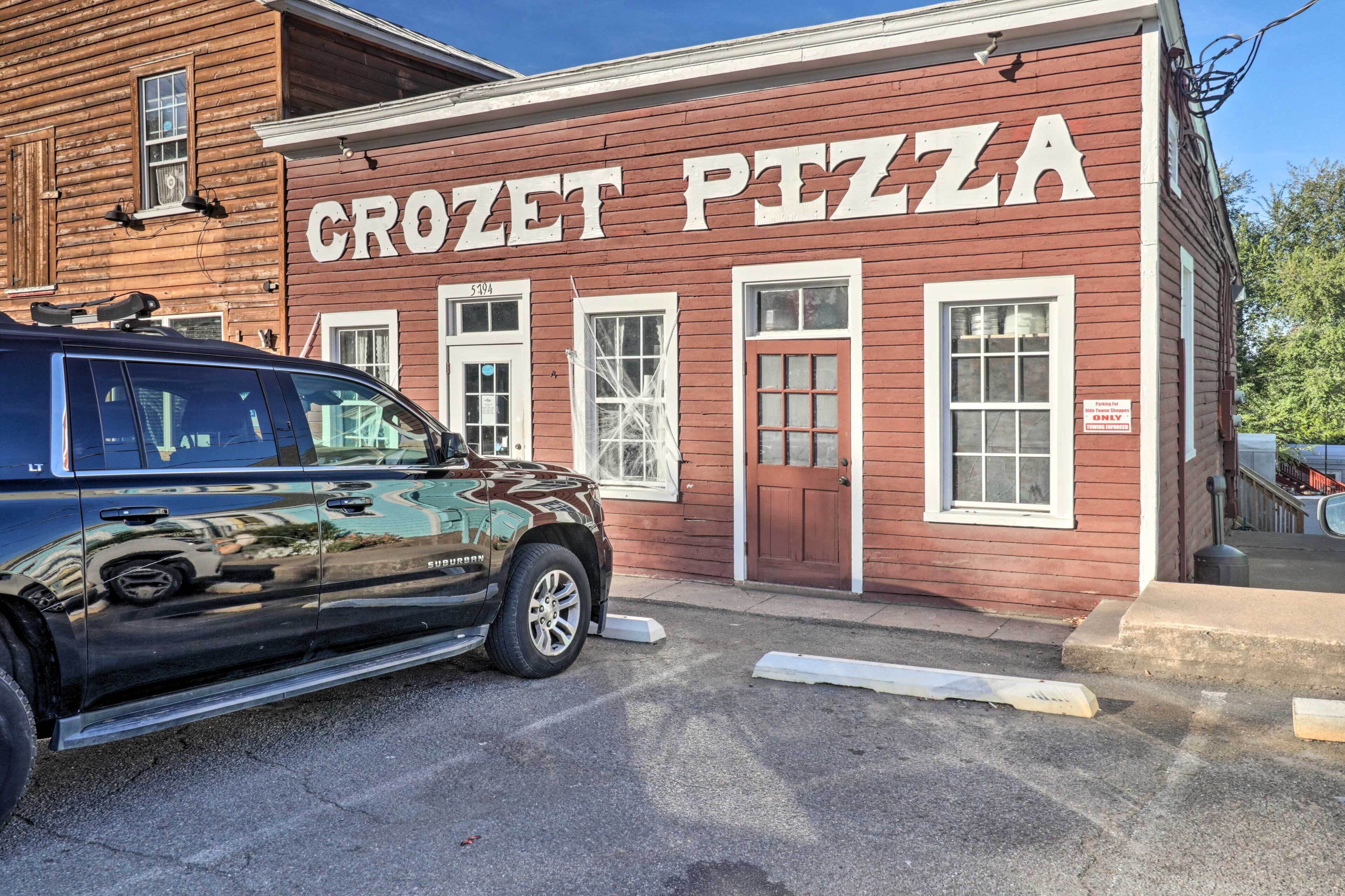 A Crozet Pizza restaurant with a red exterior and white signage.