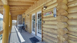A log cabin with a covered porch, a stone fireplace, and a sign reading "SUN AND FUN". - Large Sterling Cabin < 1 Mi to Palisade State Park (Sterling)