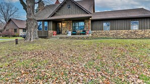 A large, two-story house with a stone foundation and a wooden exterior. - 14 Mi to Frankenmuth: Apt on 3 Acres in Clio! (Clio)