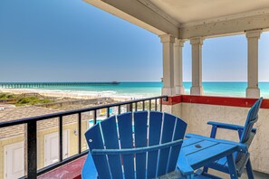 A balcony with a view of the ocean, a pier, and beach. - Ocean Views + Resort Pool! N Topsail Beach Condo (Sneads Ferry)
