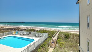 A pool with a view of the beach and ocean. - Ocean Views + Resort Pool! N Topsail Beach Condo (Sneads Ferry)