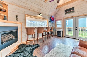 TV, fireplace, books - Pet-friendly Home w/ Deck + Mountain Views! (Maggie Valley)