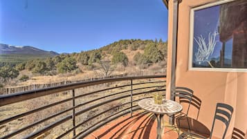 Enjoy breathtaking views of the surrounding mountains from this balcony.