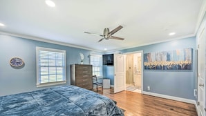 A bedroom with a bed, dresser, desk, chair, and a ceiling fan. - Ranch-style Home 7 Mi to Downtown Greensboro! (Greensboro)