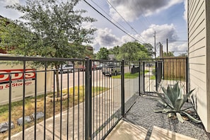 A gated area with a storage unit, a sidewalk, and a large agave plant. - 3 Mi to Daikin Park: Gated Houston Townhome (Houston)
