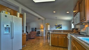 A modern kitchen with wooden cabinets, a refrigerator, stove, and a dishwasher. - 'the Fishing House' Buena Vista Home w/ Mtn Views! (Buena Vista)