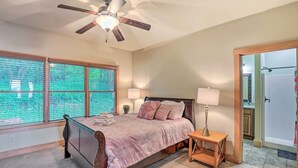 A bedroom with a bed, two bedside lamps, a ceiling fan, and a window with blinds. - Getaway Chalet in Mars Hill w/ Hot Tub & Views! (Mars Hill)
