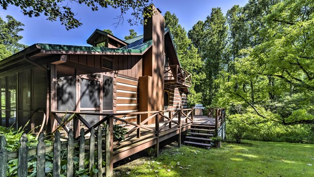 A rustic cabin with a wooden deck and stairs leading to a porch. - Black Mountain Cabin w/ Screened Porch + Views! (Black Mountain)