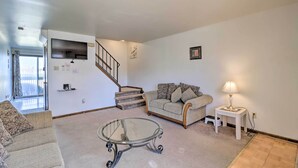A living room with a glass coffee table, a sofa, a lamp, and a staircase. - 2 Mi to Dtwn Allentown Shops & Eats! Cozy Home (Allentown)