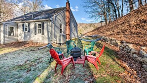 A house with a chimney, a fire pit, and outdoor seating. - Pet-friendly Mohnton House Near Golf Course! (Mohnton)