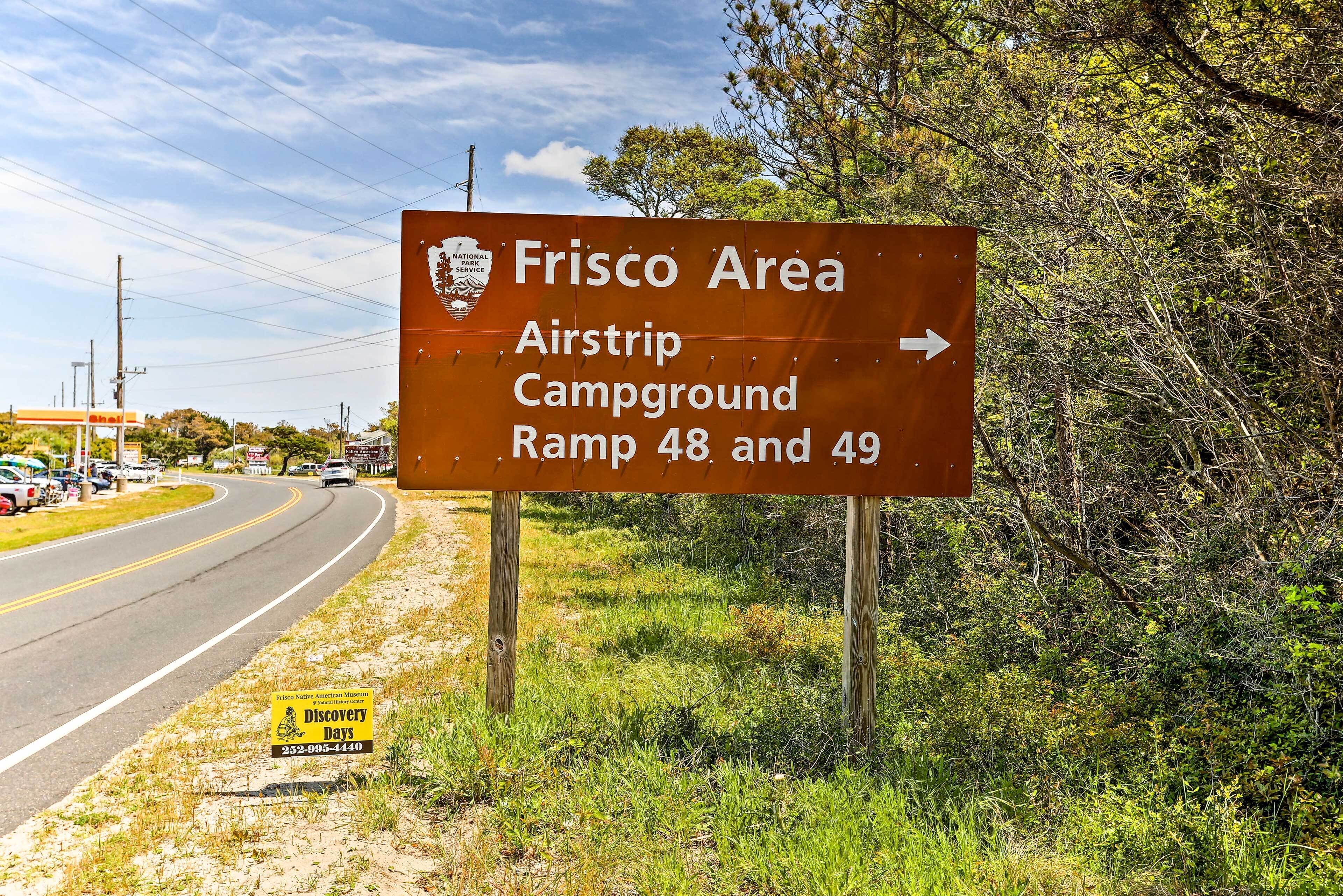 A sign indicating the direction to the Frisco Area Airstrip Campground Ramps 48 and 49.