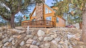 A log cabin with a stone chimney, a balcony, and a stone retaining wall. - Deck & Dry Sauna! Fairplay 'high Creek Hideaway' (Fairplay)