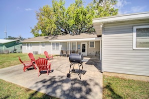A house with a covered patio, outdoor seating, and a barbecue grill. - Coastal Long Beach Rental w/ Patio, Walk to Beach! (Long Beach)
