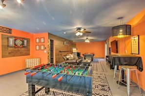 A room with a foosball table, a dartboard, and a billiards table. - Home w/ Deck & Game Room - 8 Mi to Asheville (Fairview)