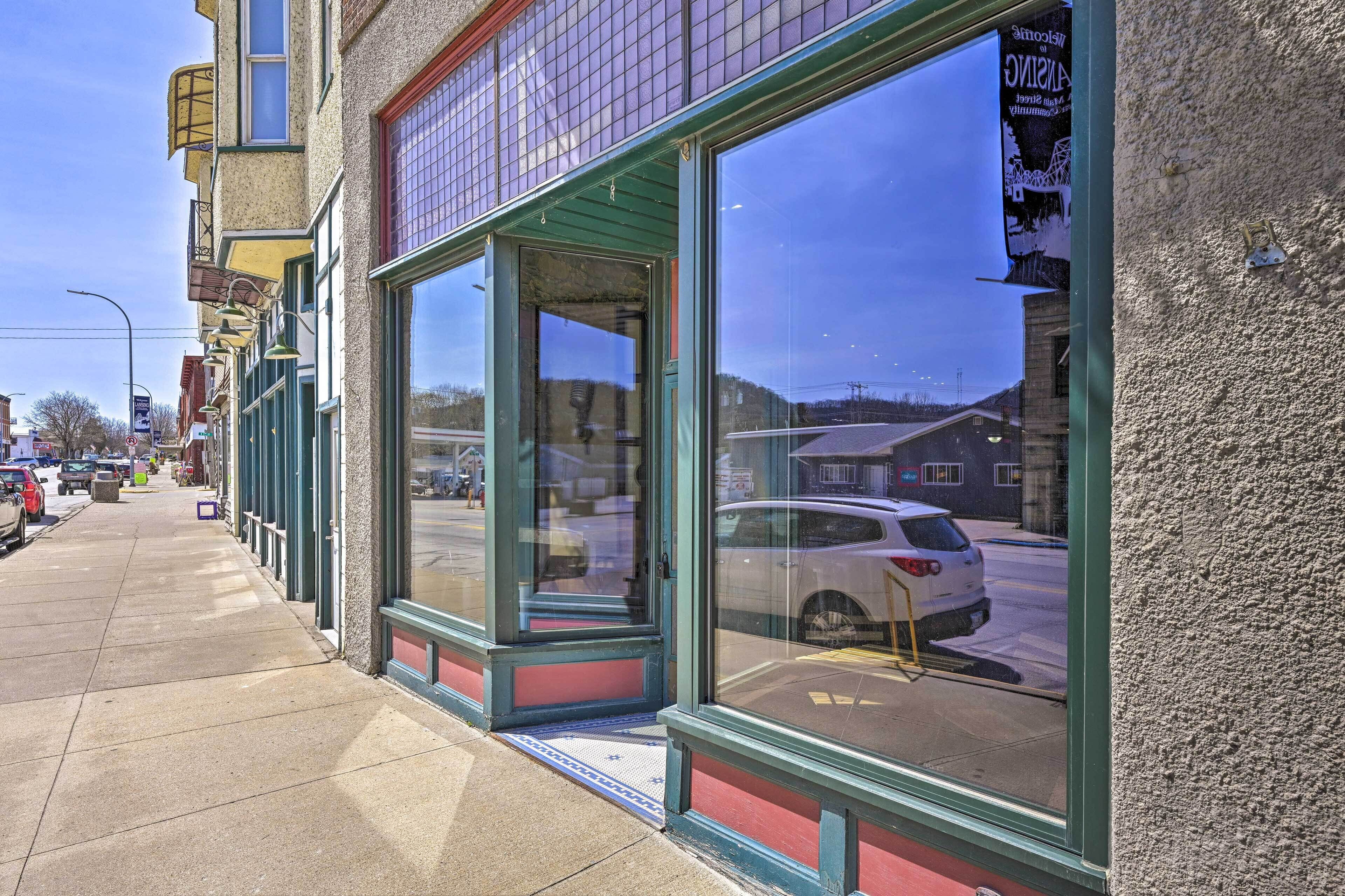 A building with large windows and a visible street view.