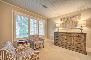 A room with a sofa, armchair, and a wooden cabinet with drawers. - Beautiful Trillium Home Next to Waterfall! (Cashiers)