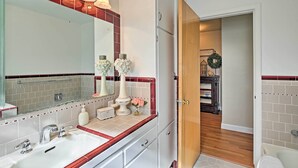 A bathroom with a large mirror, a sink, and a shower. - Ashton Escape w/ Yard: 56 Mi to West Yellowstone! (Ashton)