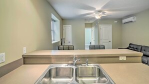 A kitchen with a double sink, a ceiling fan, and a built-in oven. - ~ 2 Mi to Downtown - Cozy Cleveland Unit (Cleveland)
