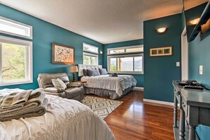 A bedroom with two beds, a chair, a desk, and large windows. - Private Blue Ridge Home w/ Hot Tub, Mountain Views (Marshall)