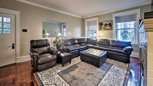 A living room with a sectional sofa, a coffee table, and a patterned rug. - Spacious Reading Home w/ Patio - 2 Miles to Pagoda (Reading)