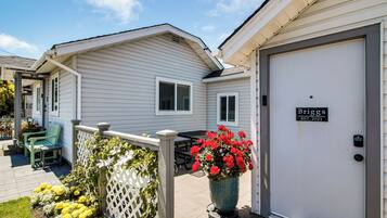 A white building with a door labeled 'Briggs EST. 2021'.