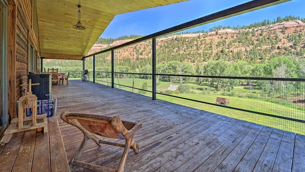A wooden deck with a view of a mountainous landscape. - Direct Hiking Access: Riverfront Dolores Home! (Dolores)