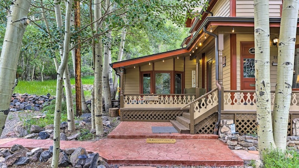 A wooden house with a porch, stone steps, and a mailbox. - Family Home in Georgetown: Walk to Town & Railroad (Georgetown)