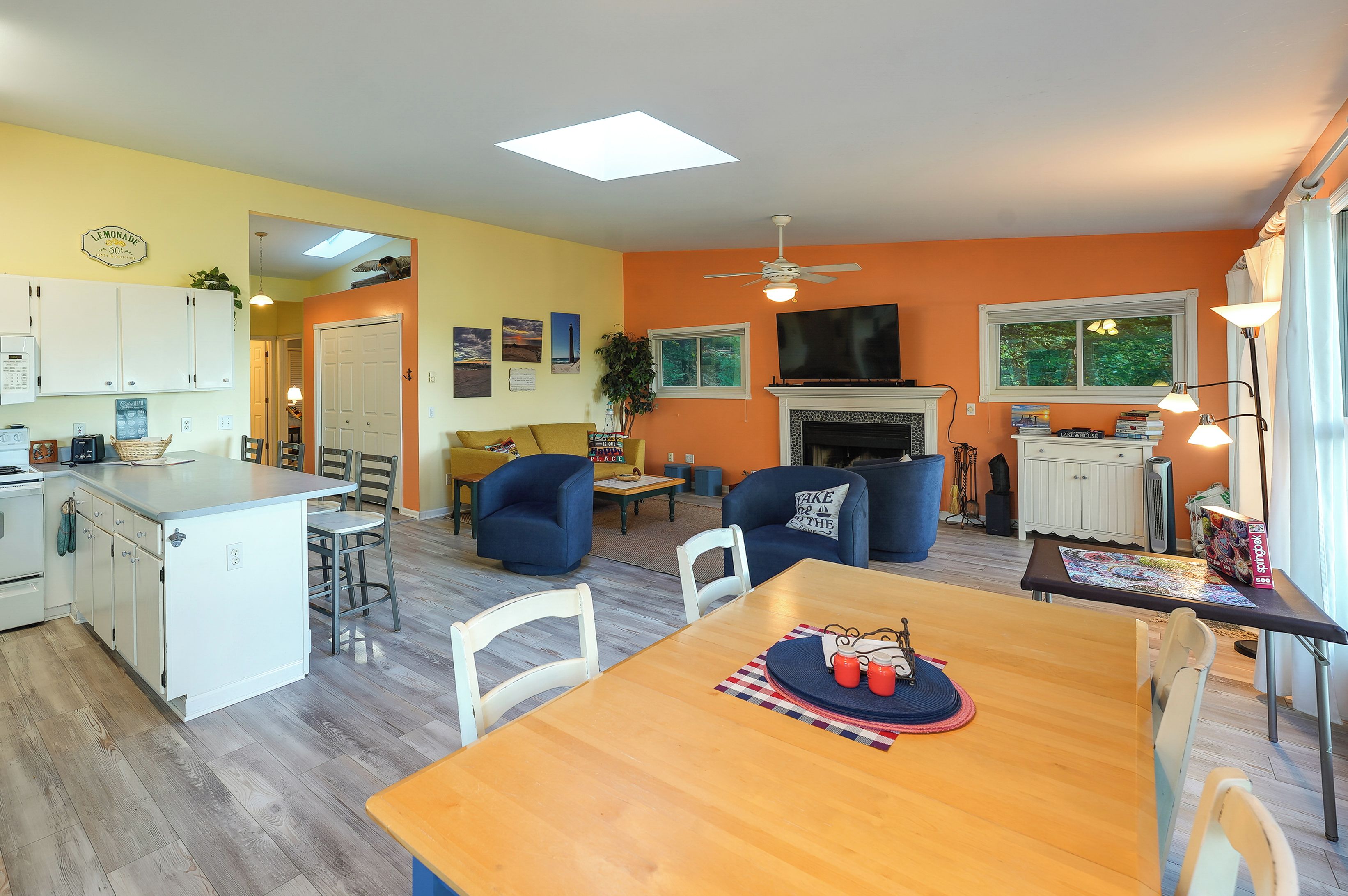 A compact living space with a kitchen, dining area, and seating.
