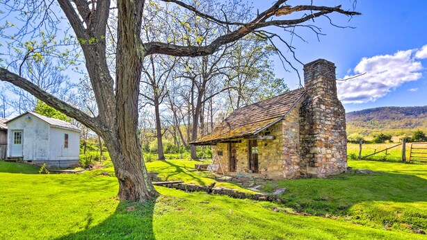 A stone building with a chimney, surrounded by a grassy area and trees. - Historic 'hammond House' w/ Wine Country View! (Strasburg)