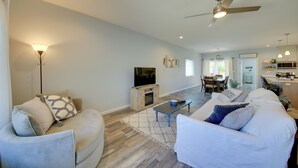 A spacious living room with a sofa set, a coffee table, and a television. - 3 Mi to Lake Pend Oreille: Home w/ Deck & Yard (Ponderay)