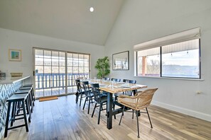 Enjoy meals with family and friends in this dining area, surrounded by large windows and a beautiful view.