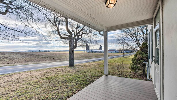 A covered porch with a view of a road and fields. - Stevens Vacation Rental ~ 14 Mi to Lancaster (Stevens)