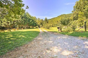 A gravel path leading through a park with picnic tables and trees. - 'the Creek' Winfield Gem: 73 Acres of Privacy (Winfield)