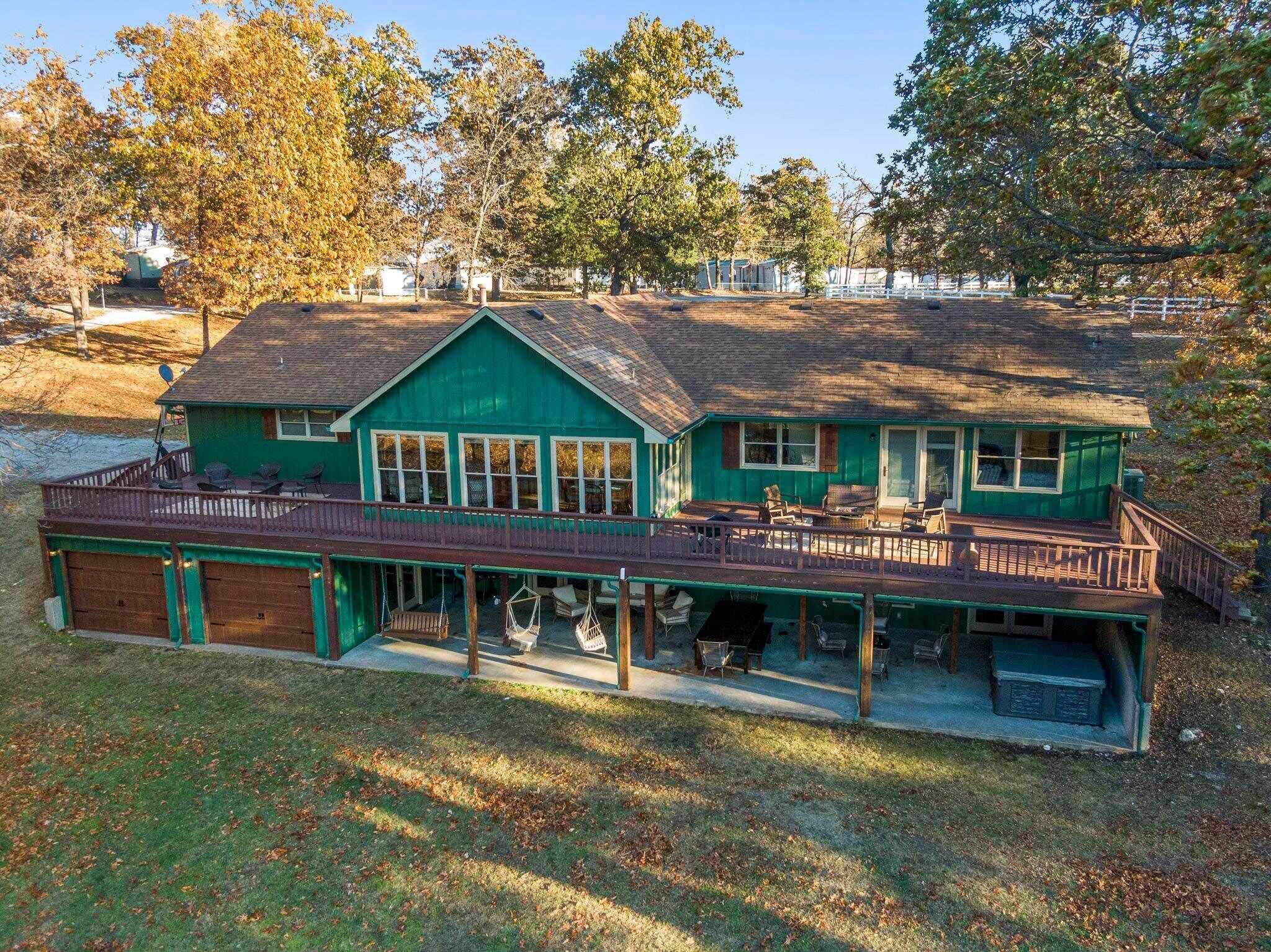 Lakefront Grove Home w/ Dock, Hot Tub, & Fishing!
