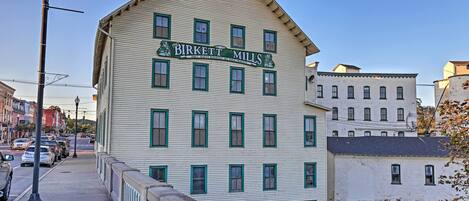 A historic building with a sign reading "Birkett Mills."