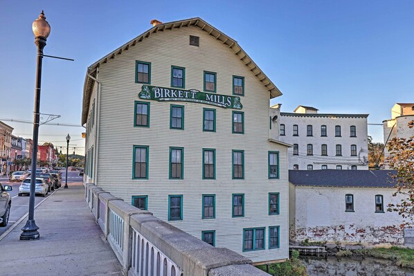 A historic building with a sign reading "Birkett Mills." - Newly Renovated Penn Yan Apartment < 1 Mi to Lake! (Penn Yan)