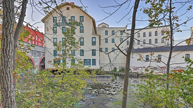 A riverside view with a building labeled "Birks" and a stone bridge.