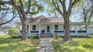 A two-story house with a stone pathway leading to the front door. - Charming Georgetown Home - Walk to Downtown! (Georgetown)