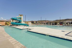 A swimming pool with a water slide and a lifeguard tower. - Home w/ Patio, 37 Mi to Zion National Park (Washington)
