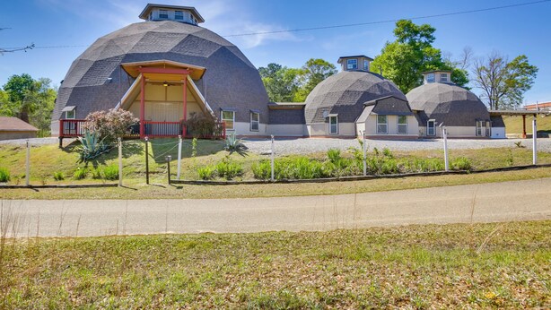 A house with a unique dome-shaped roof and a red door. - Remote Angie Vacation Rental Near Pearl River! (Angie)