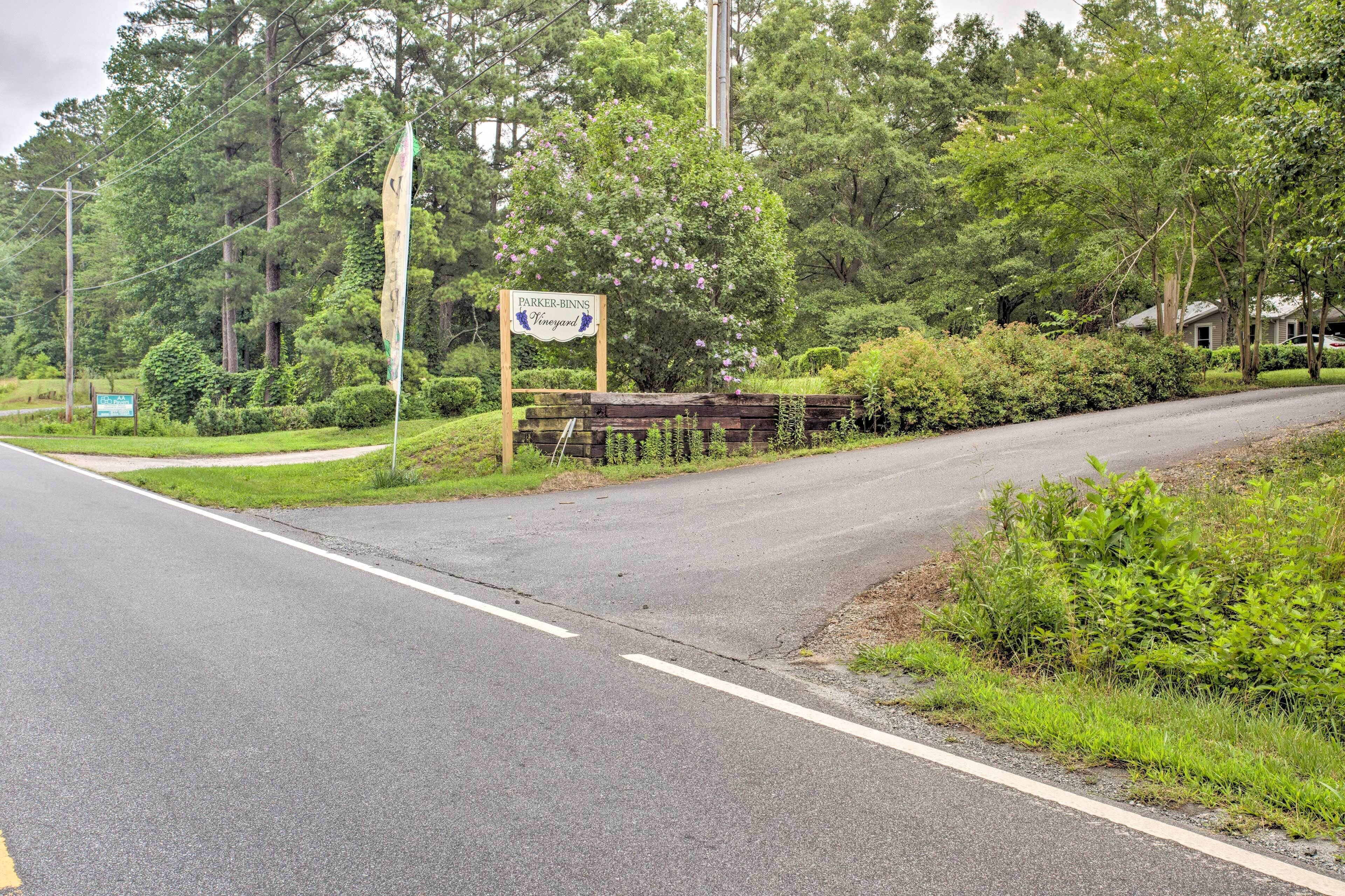 A rural road with a sign for Parker-Binns Vineyard.