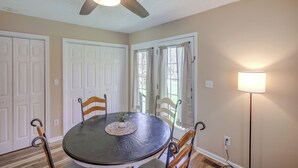 A dining area with a round table, chairs, a ceiling fan, and a floor lamp. - Tracy City Home Near South Cumberland State Park! (Tracy City)