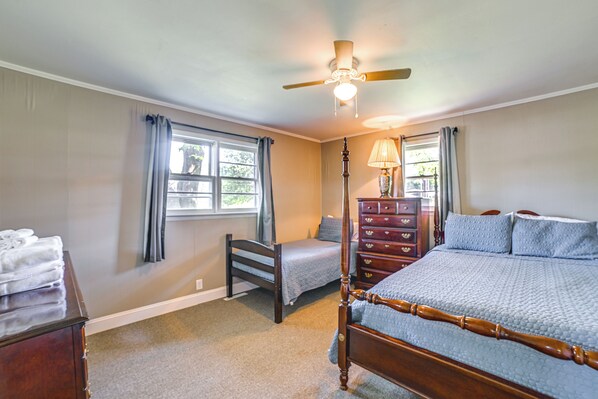 A bedroom with a bed, dresser, chair, and a window with curtains. - 'vick's Hunting Lodge' Near Fishing + Hiking (Salem)