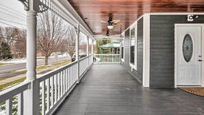 A covered porch with a wooden ceiling and a white railing. - Walkable Sodus Point Retreat < 1 Mi to Lake (Sodus Point)