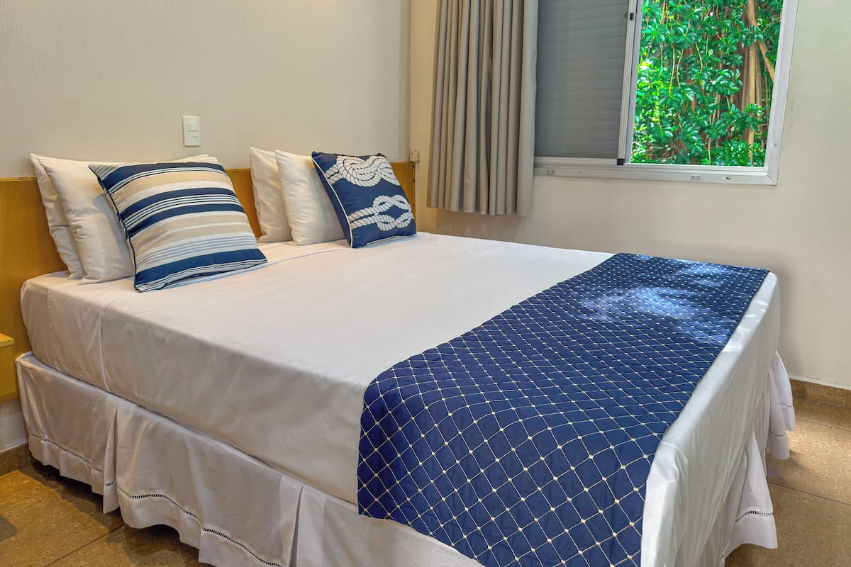 Chambre Deluxe | Minibar, accĂšs au Wi-Fi (inclus), literie fournie