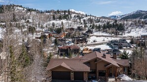 A residential area with houses, a ski slope, and a mountain in the background. - Lower Deer Valley with Amazing Views, Private Hot Tub, Walk to Old Town (Park City)