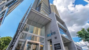 A modern building with the name 'Skyline' and the number '30' on its facade. -  Skyline hosted by AAB (Brisbane)