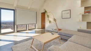 TV, books - Morgan Branch Cabin | Modern Mountain Cabin with Panoramic Views Near Asheville (Marshall)