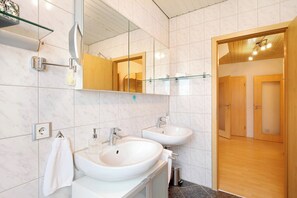 Bathtub, hair dryer, towels